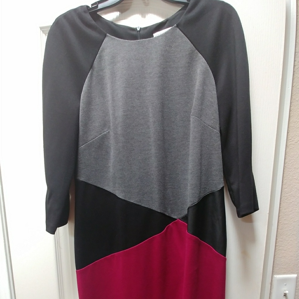 3/4 length dress with faux leather triangle. Black